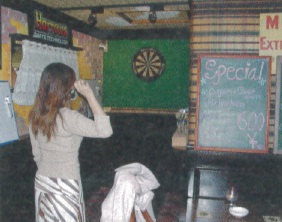 Kumiko plays darts