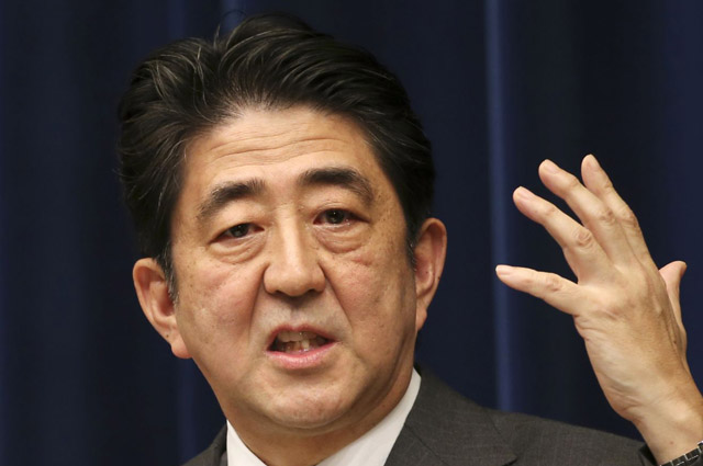 Abe defends secrets act as ratings drop