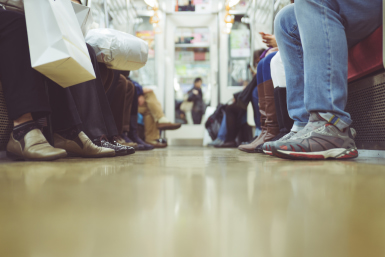 Passengers feet in subway car