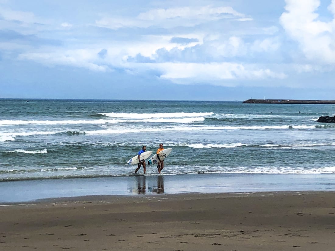 Japanese Surfers finish surfing at Tsurigasaki Beach in Chiba