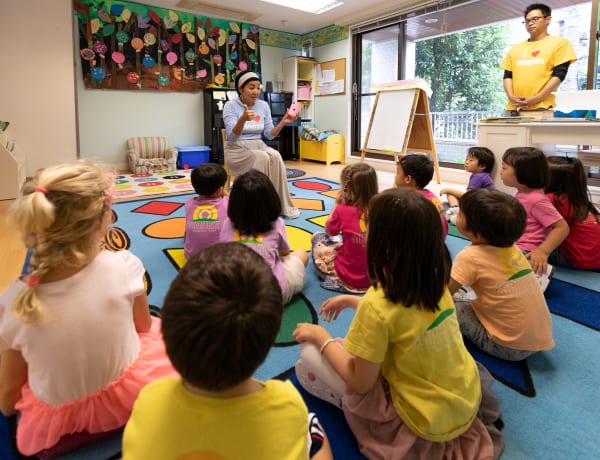 Children listen to teacher at Summerhill International School