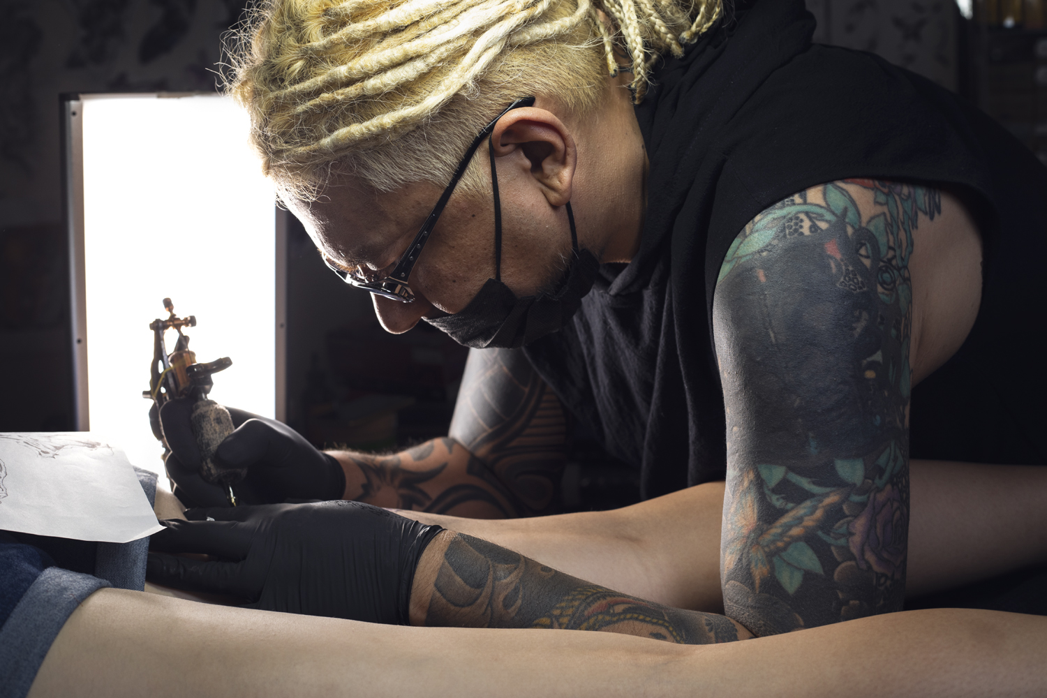 tattoo artist at work in studio tokyo