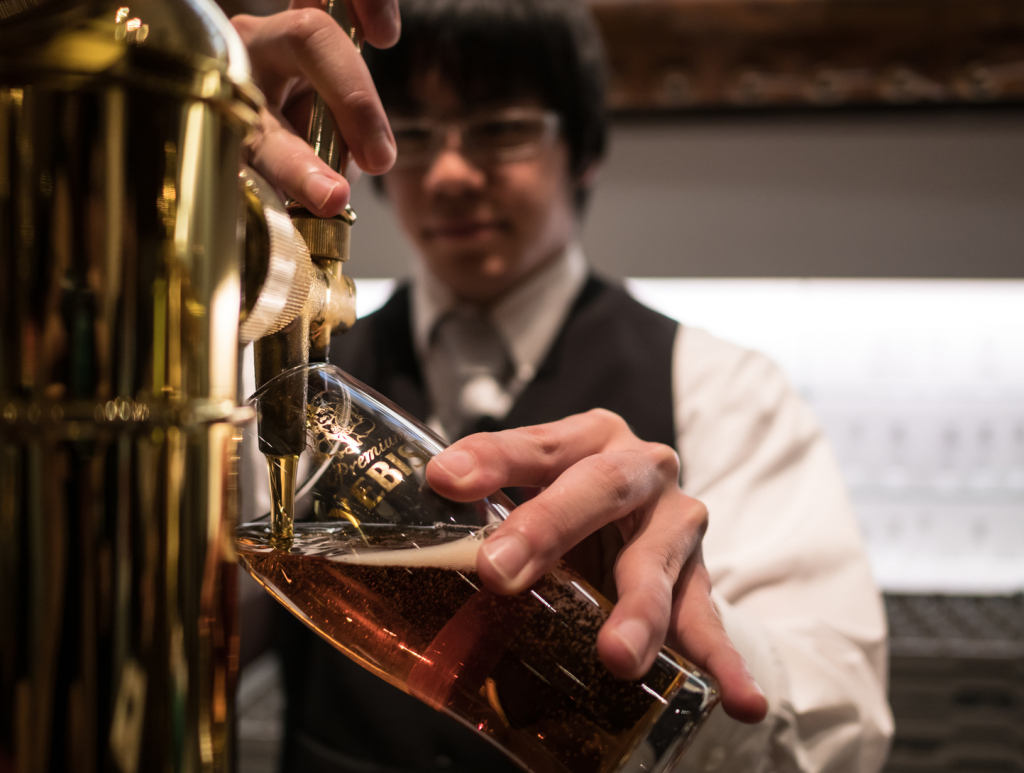 Bartender pouring beer in Tokyo