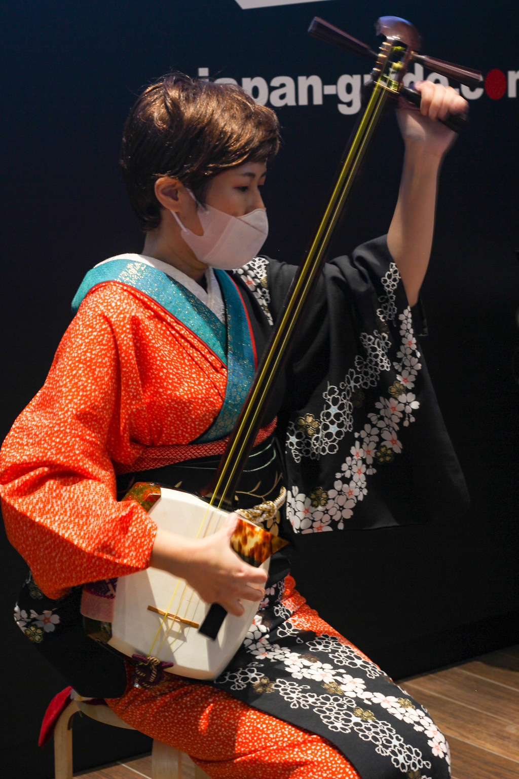 XX performing a piece of tsugaru shamisen, a more lively, rhythmic and