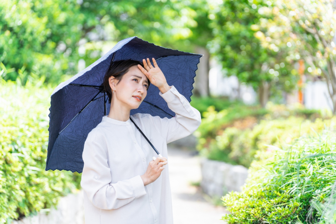 modern higasa japanese parasol woman using against grean background