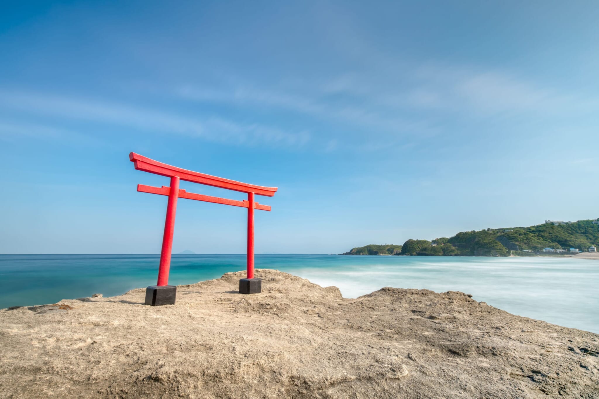 Red Shinto torii gate at Shirahama Beach Shimoda.